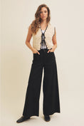 Load image into Gallery viewer, Gabriela Crochet Sweater Vest in natural and black with lightweight crochet knit, scalloped edges, and dainty front bow ties, perfect for sunny days and breezy evenings.