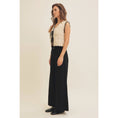 Load image into Gallery viewer, Side view of versatile Gabriela Crochet Sweater Vest with feminine scalloped edges, front bow tie, and lightweight crochet knit, perfect for layering or wearing alone in warm weather.