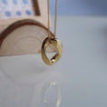 Load image into Gallery viewer, Anya Infinity Pendant Necklace in Gold, featuring an 18K gold-plated infinity charm on a delicate 16-inch stainless steel chain with a 2-inch extender.