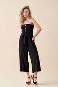 Load image into Gallery viewer, Shiloh Smocked Tube Top Jumpsuit in Black. Featuring a strapless smocked bodice, self-tie waist, and wide-leg silhouette, crafted from a breathable cotton-linen blend for a relaxed yet polished look.